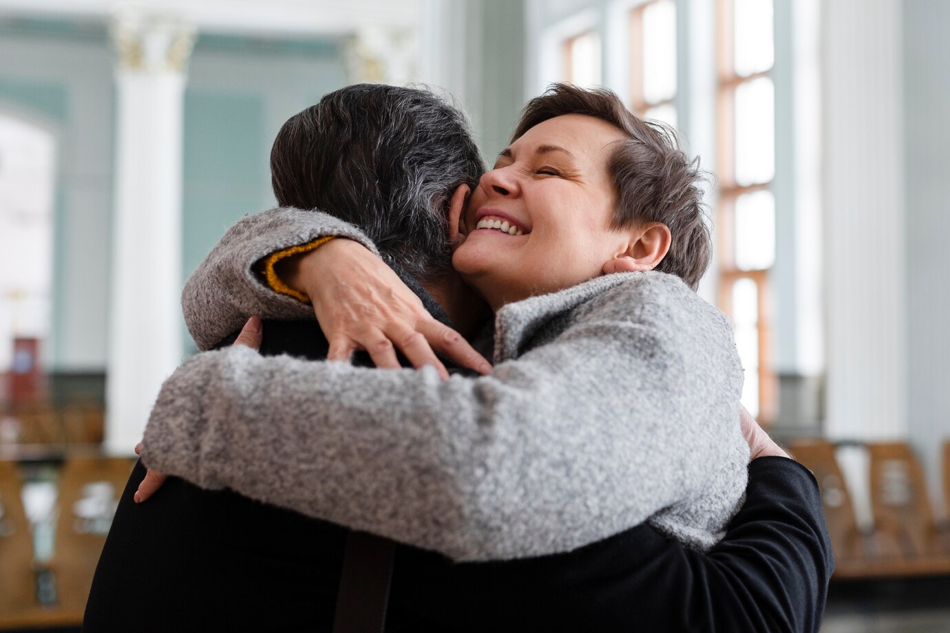 medium-shot-smiley-woman-hugging-man_23-2149338632