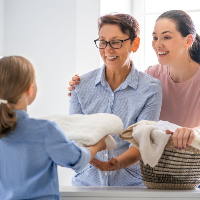 NDIS support worker assisting with domestic tasks